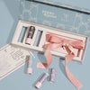 Poppy & Pout x Kaxi lip balm and bow gift set on a blue background., 2 of 8