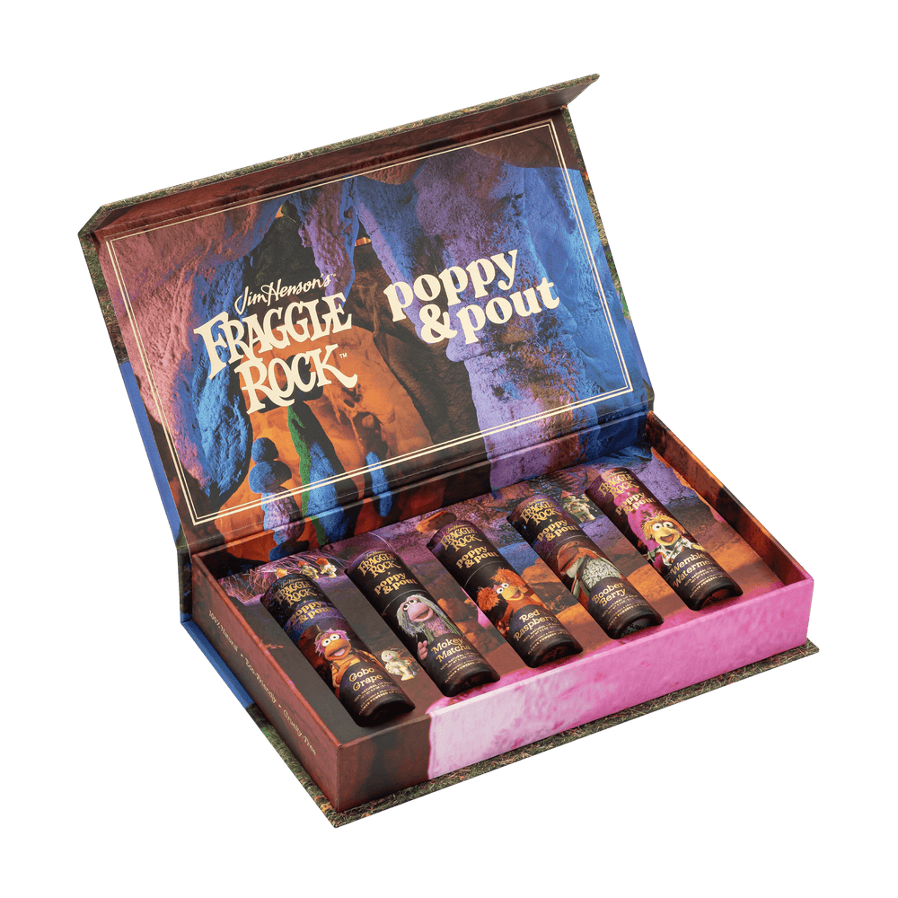 Open gift set box of Fraggle Rock lip balm. Gobo Grape, Mokey Matcha, Red Raspberry, Boober Berry, and Wembly Watermelon.