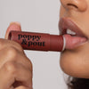 Women Using Poppy and Pout Cinnamint Lip Balm, 3 of 5