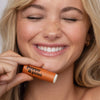 Women with Smiley Face Holding Lip Balm Orange - Poppy & Pout, 3 of 6