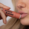 Women Using Poppy & Pout Pomegranate Peach Lip Balm, 4 of 6