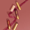 Lip tints on a pink background with ribbon, 5 of 7