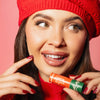 Up close of girl holding Sugared & Spiced lip balm., 3 of 6